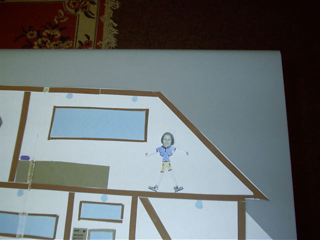 Katie makes herself at home in her new bedroom.