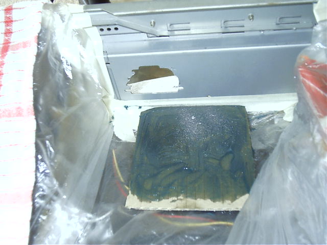 Greased cardboard to collect metal filings