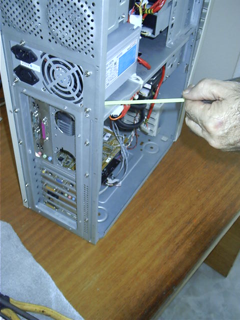 Dad uses a straw and vaccuum to clean case