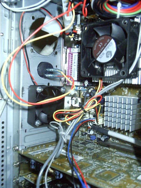 The button from the inside, between the 2 new fans