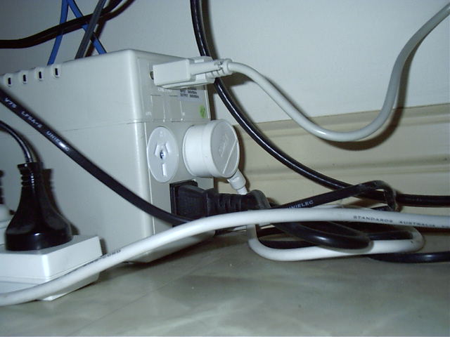 2 plugs on back and a com port connection to monitor UPS