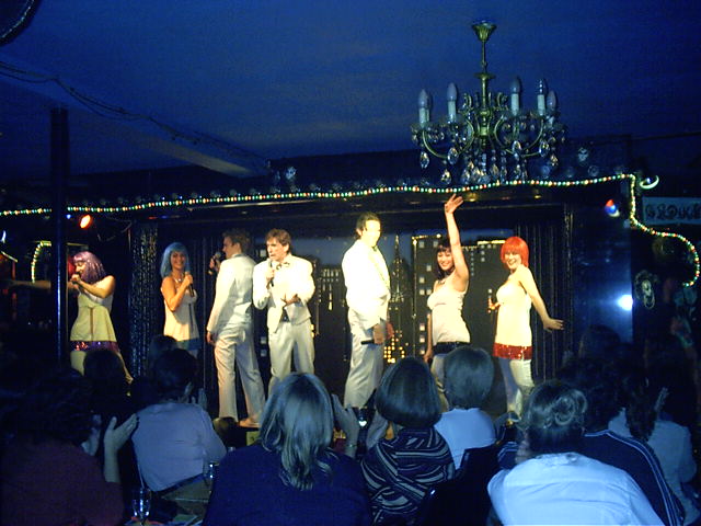 The host and comedian with the performers