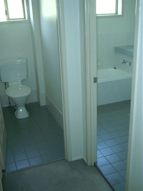 Toilet and bathroom.