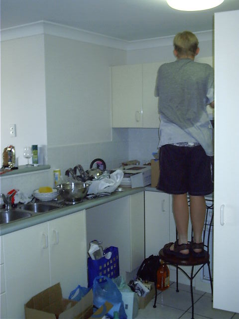 Pat cleans the kitchen.
