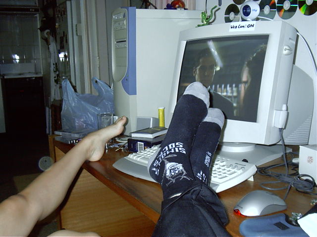 Katie's and my feet watch Buffy Season 3 DVDs.