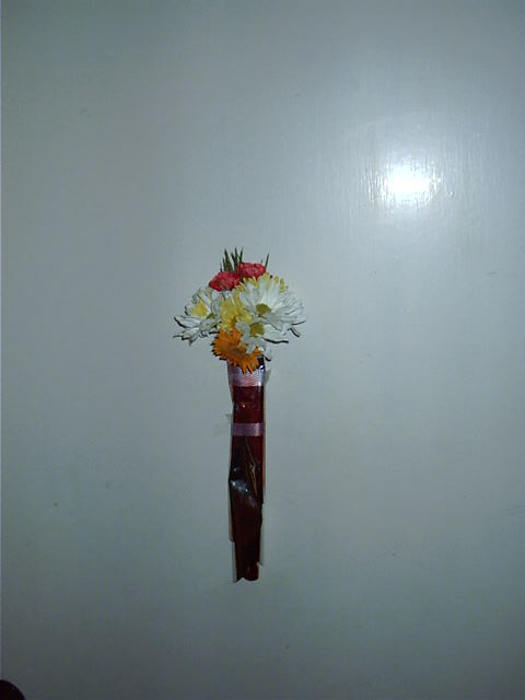 The flowers I gave when she had a bad day, remade into a smaller door mounted bunch.