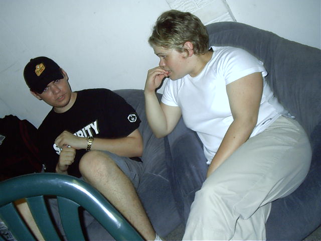Braggy is asked a few questions by the bouncer.