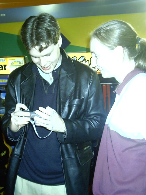 Lash and Vicki check out his pics on his camera