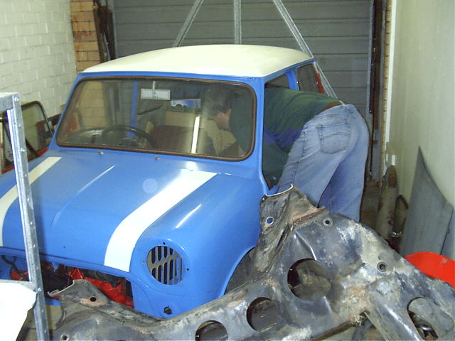 Dad packs the garage into the mini