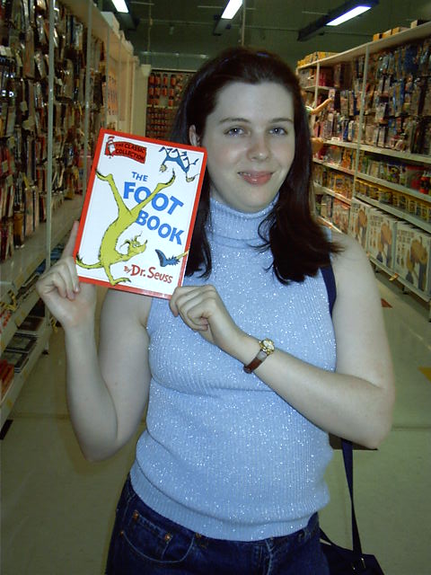 Tanya picks up a much needed reference manual for her podiatry work.