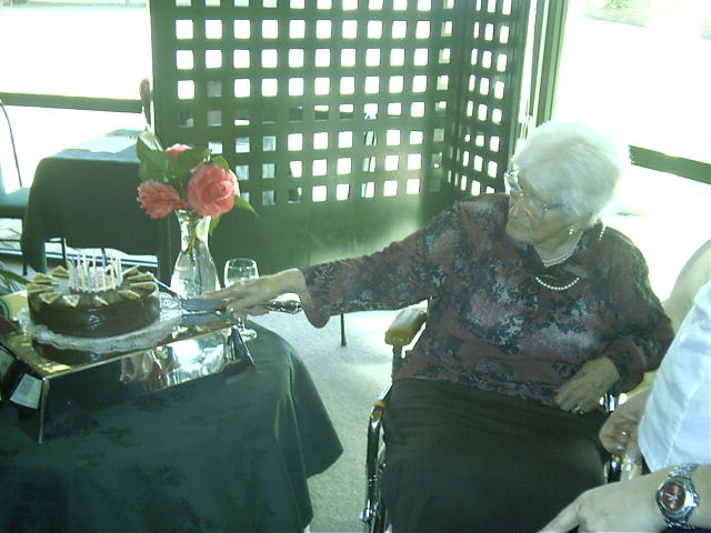 Nana cuts cake