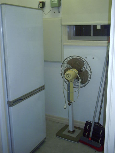 3rd fridge gets tucked away