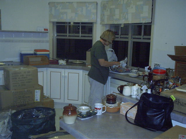 Mum sorts kitchen