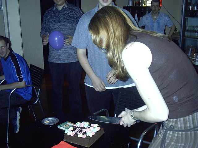 Liz cuts her cake