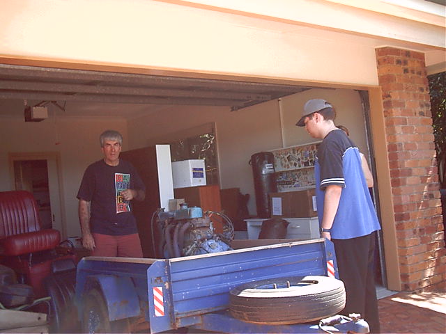 Draxy and dad do something with a mini engine