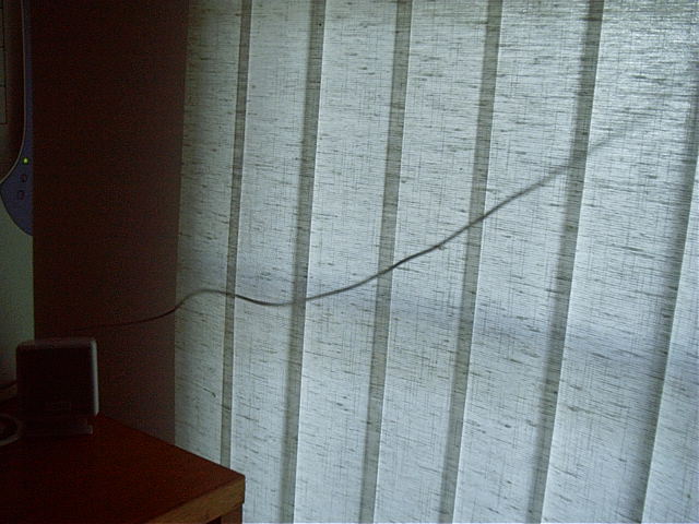 Web cam cable going from computer behind blinds