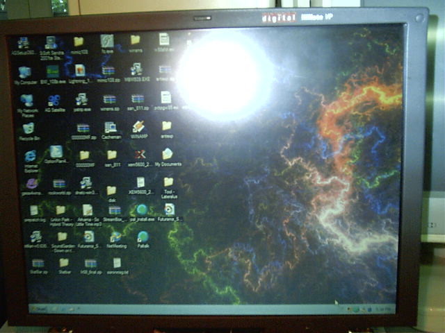 His laptop has a funky wallpaper.