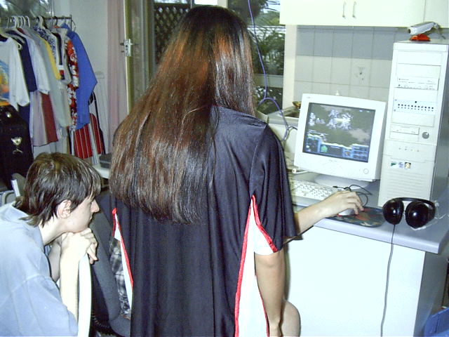 The lan watches a BW game and places a bet on which 'newbie' would win.
