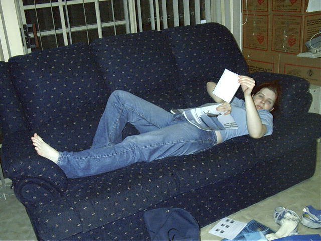 Tanya relaxes on couch after some Video camera shopping