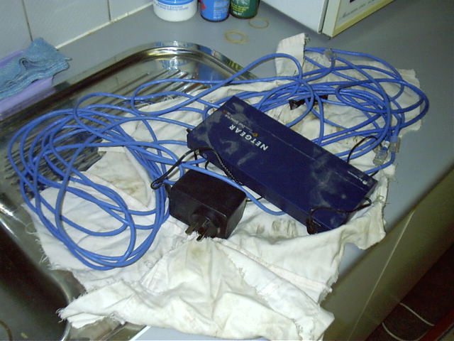 After finding a 6 port hub at work, dad brings it home along with some cables.