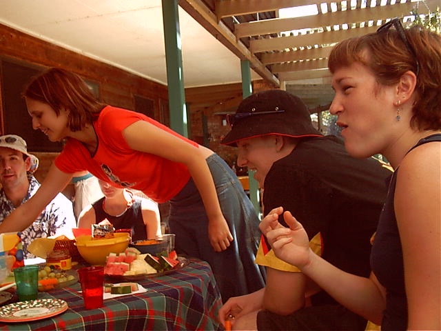 Lui reaches for some food. Xab and Trui also feast