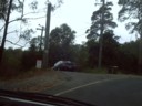 No, she is not driving off a cliff. Thats their driveway. Can we say 'steep decent'?