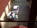 Dad starts unpacking the car.