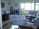 Lounge room upstairs with TV and stereo my parents use.