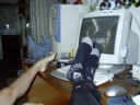 Katie's and my feet watch Buffy Season 3 DVDs.
