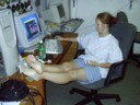 Katie makes herself at home with my computer, and chair, and shorts, and t-shirt.