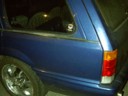 The car with the funky paint that reflected red