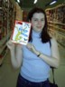Tanya picks up a much needed reference manual for her podiatry work.
