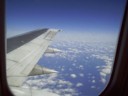 The wing of the plane going over