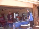 Draxy and dad do something with a mini engine
