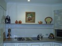 Painting hung in kitchen