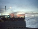 Enrique takes a pic of the setting sun, and my front car window