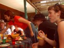 Lui reaches for some food. Xab and Trui also feast